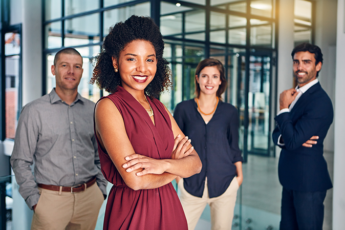 Portrait, confidence and business people in office with woman, leadership and project manager at law firm. Teamwork, professional and group with lawyer, attorney or legal consultant with arms crossed.