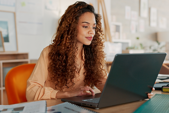 Black woman, documents or working on laptop planning, creative research or data analysis for marketing project management review. Business, typing corporate report, schedule or SEO calendar agenda.