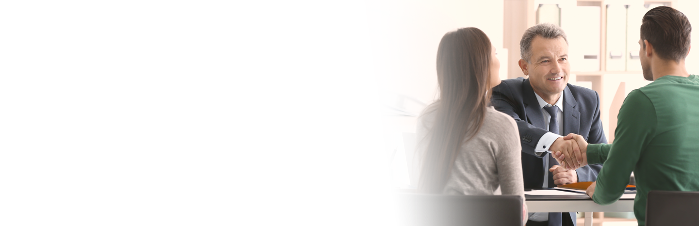 Lawyer shaking hands with clients in the office